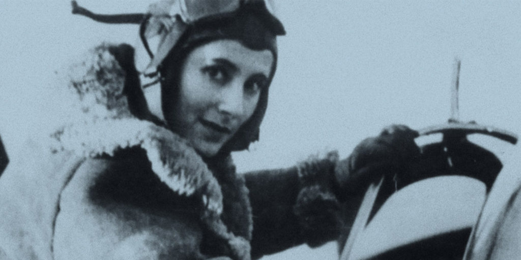 A black and white portrait photograph of Amy Johnson, the pioneering aviator from Hull. Her confident expression and classic 20th-century attire reflect her status as a trailblazing female pilot