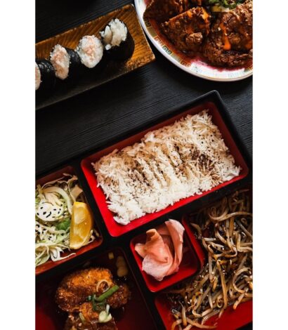 Various food plater including Menchi Katsu Bento, Crab & Garlic Sushi, Karaage