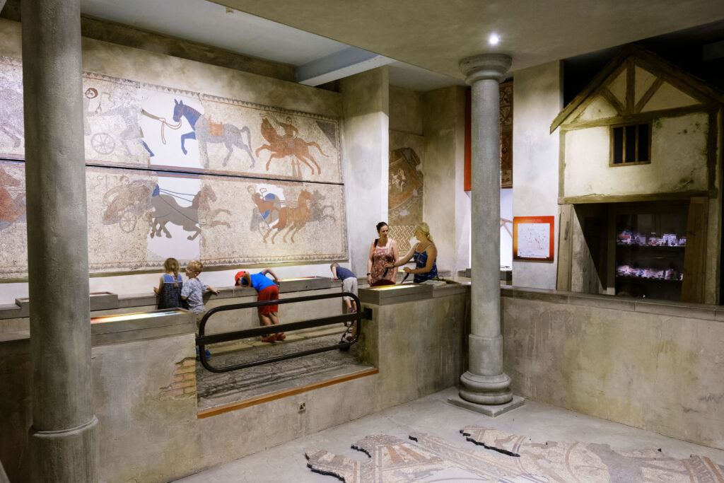 Roman Mosaic depicting people and horses at the Hull and East Riding Museum