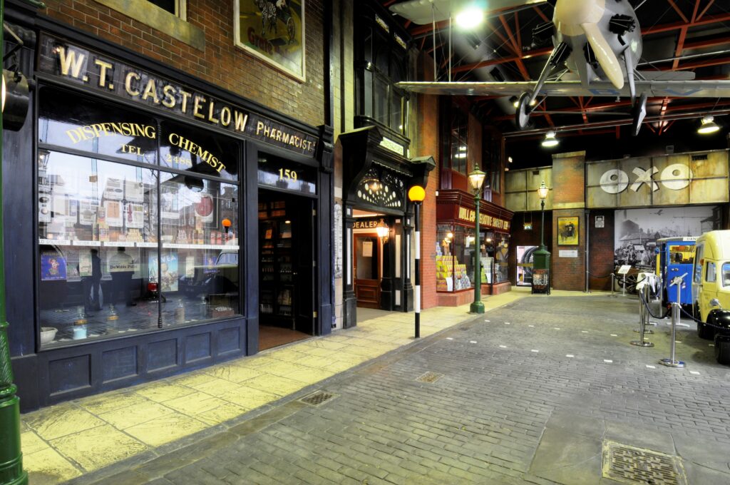 A recreated 1940s High Street inside the Streetlife Museum in Hull. The exhibit features period shopfronts, vintage signage, and cobbled streets, offering an immersive glimpse into wartime Britain’s daily life and commerce