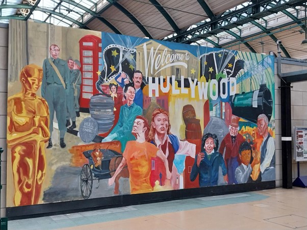 The Hullywood mural in Paragon Interchange, Hull, featuring a vibrant tribute to the city’s cinematic connections. The artwork showcases iconic film-inspired imagery blended with Hull’s local history, culture and film set locations.